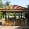 Free standing patio structure with outdoor kitchen